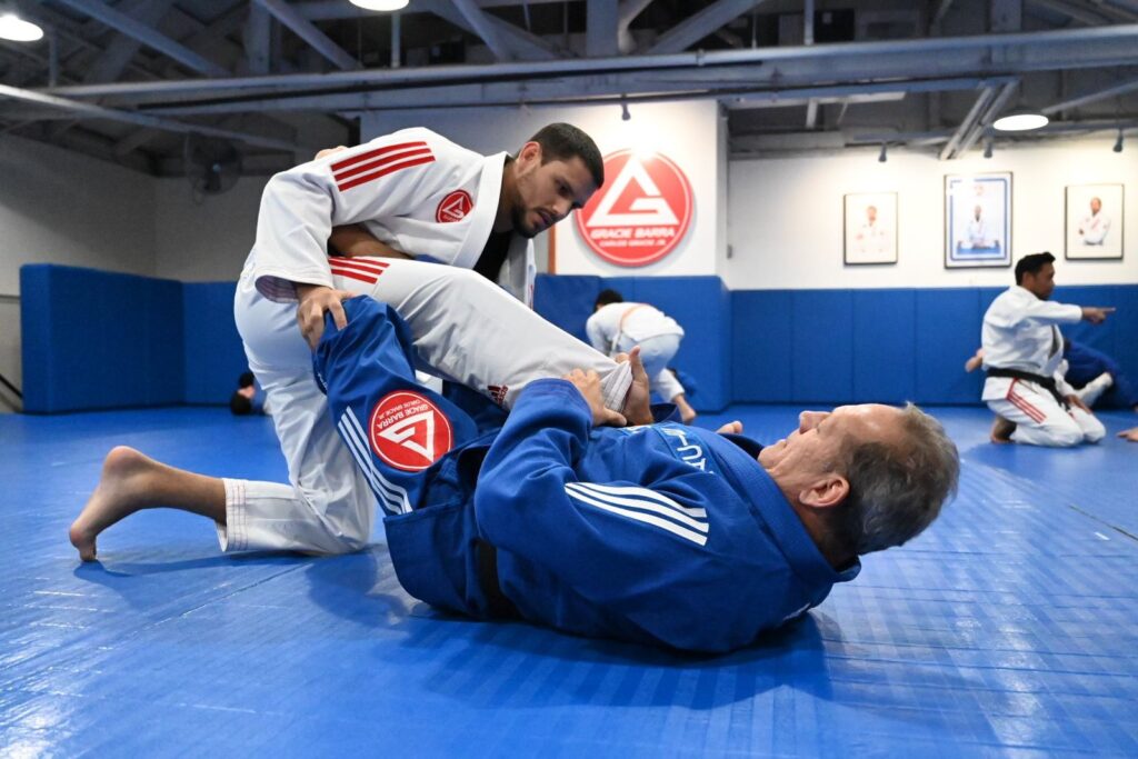 Adult students drilling Jiu-Jitsu on the mats