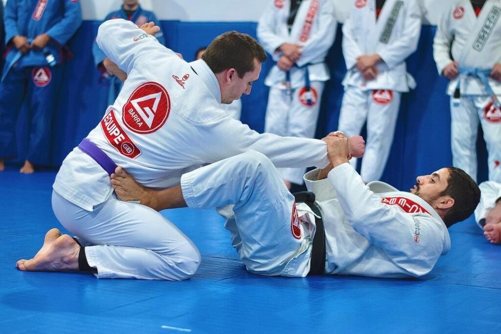 Advanced Brazilian Jiu-Jitsu students training guard positions