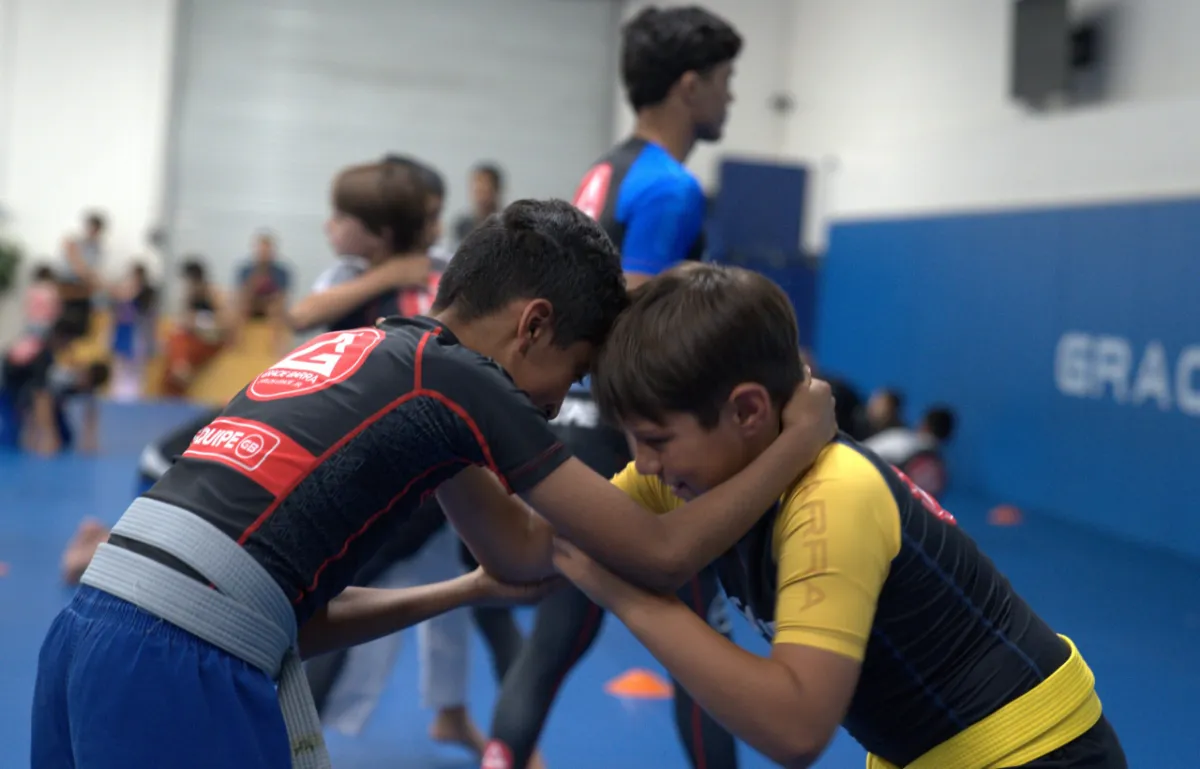 Kids drilling Jiu-Jitsu with a partner at Gracie Barra Upland